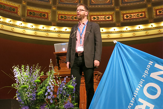 A man standing, presenting at Nordunet Conference