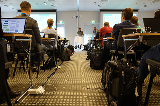 A Group of Nordunet Conference attendees attentively listening to the presentation in Conference room